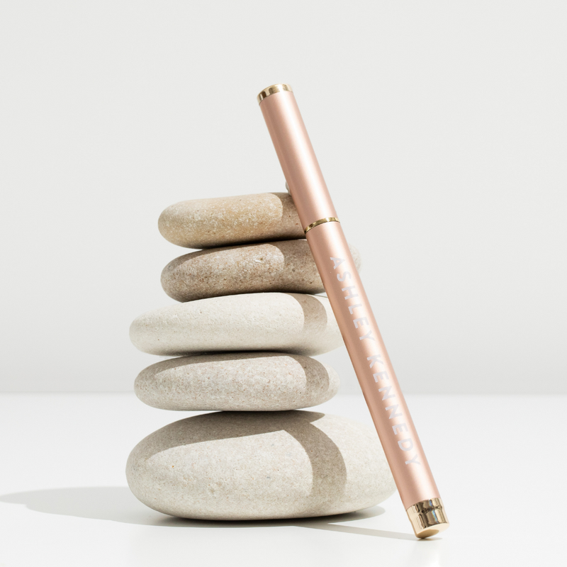 Champagne color adhesive pen for lashes by Ashley Kennedy.
